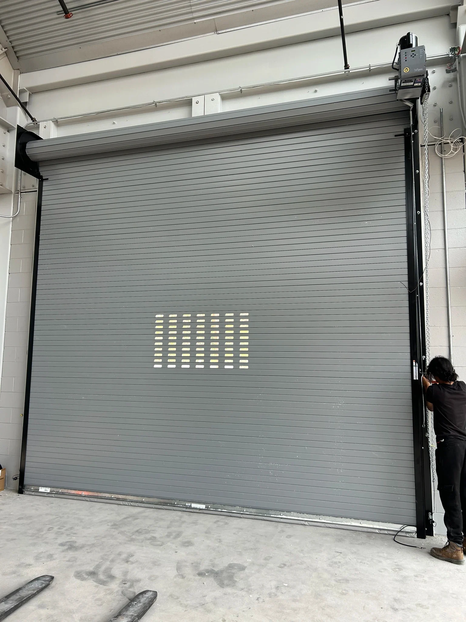 Interior view of a gray rolling steel service door