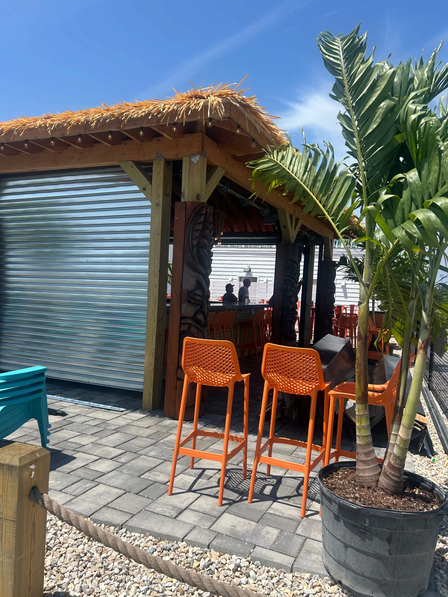 Compact rolling steel shutter installed at an outdoor service opening