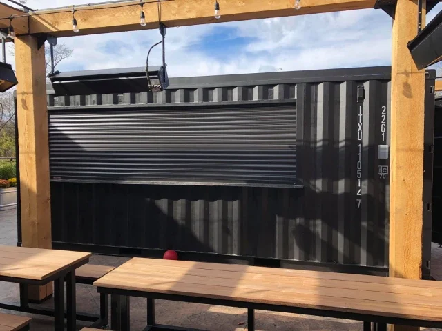 Wide commercial opening with compact overhead storage needs