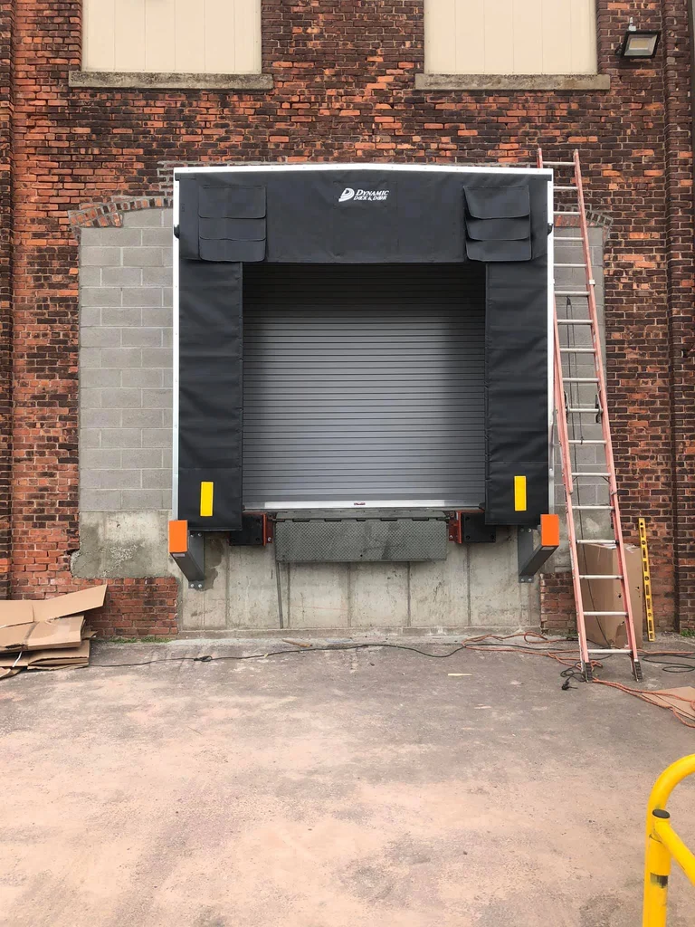 Commercial loading dock with a rolling overhead door